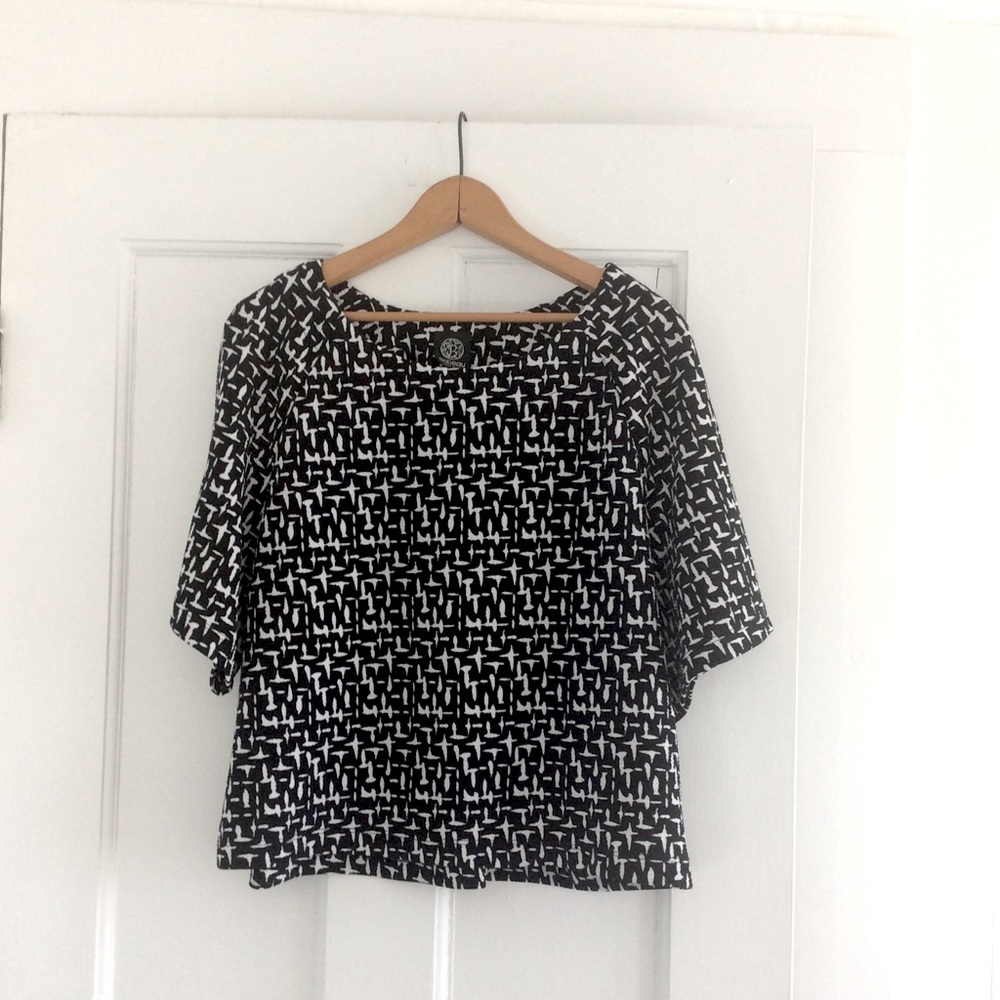 A woman’s black and white top.